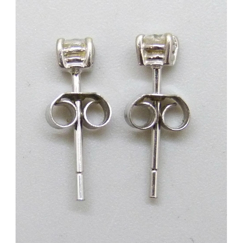7236 - A pair of 18ct white gold diamond ear studs, 0.8g