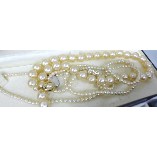 7244 - A collection of costume jewellery including a string of pearls with a 14ct gold clasp, 10.6g