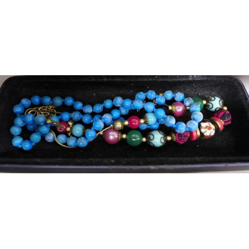 7244 - A collection of costume jewellery including a string of pearls with a 14ct gold clasp, 10.6g