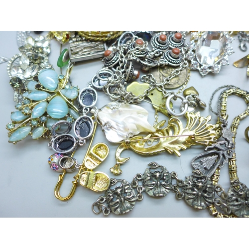 7249 - A collection of costume jewellery including a silver mounted resin flower pendant