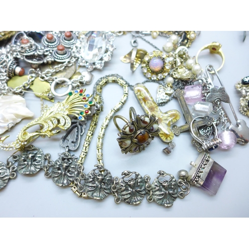 7249 - A collection of costume jewellery including a silver mounted resin flower pendant