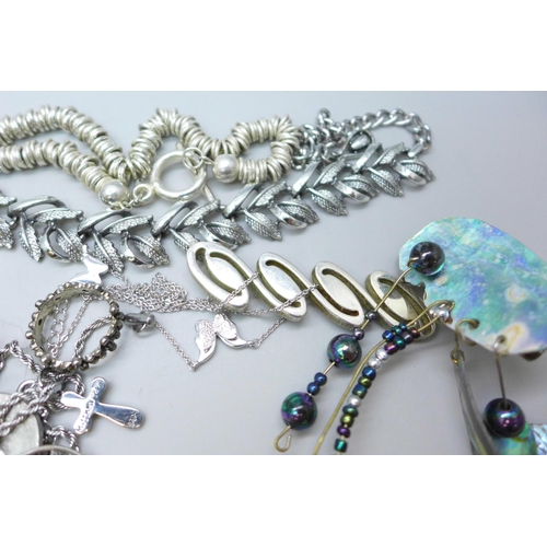 7249 - A collection of costume jewellery including a silver mounted resin flower pendant