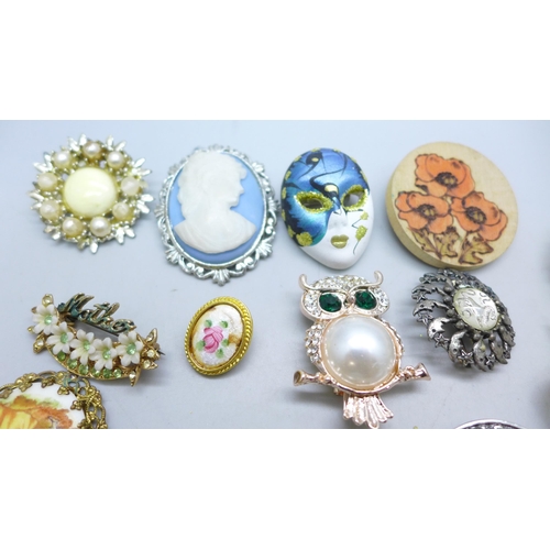 7251 - A collection of twenty two costume brooches and a scarf clip