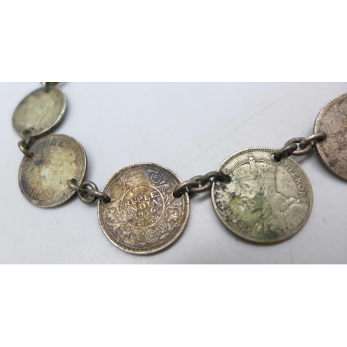 7272 - A coin bracelet including UK, USA and New Zealand coinage, 25g, 28cm