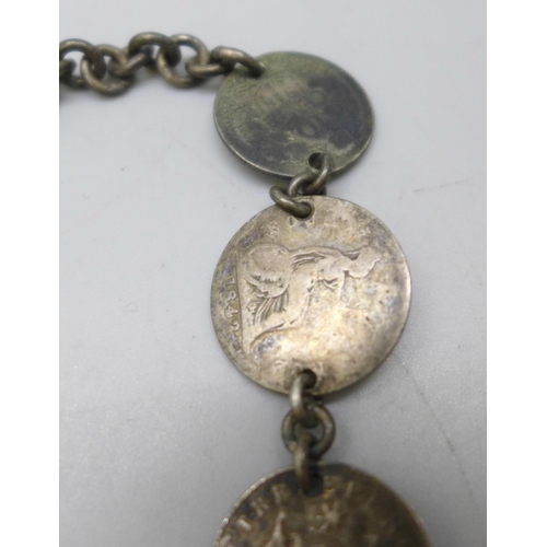 7272 - A coin bracelet including UK, USA and New Zealand coinage, 25g, 28cm