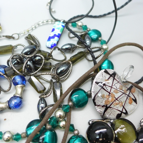 7273 - A collection of glass jewellery including pendants and necklaces