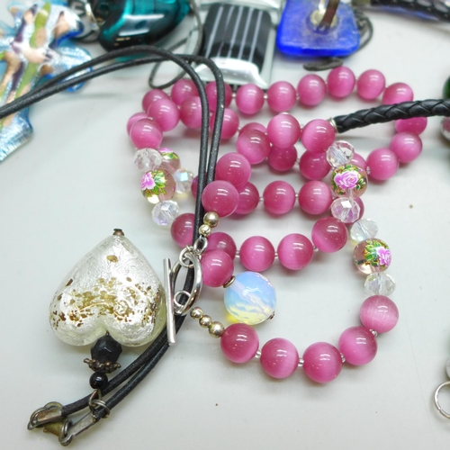 7273 - A collection of glass jewellery including pendants and necklaces