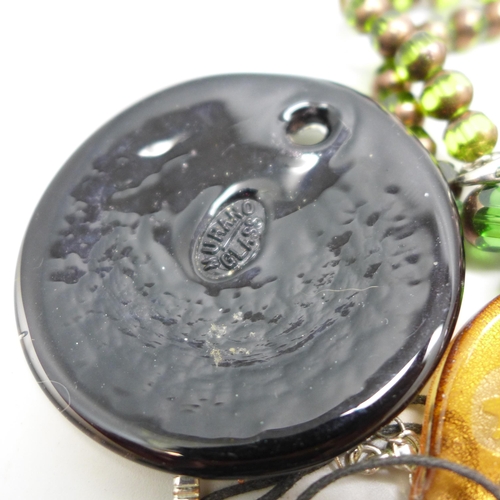 7273 - A collection of glass jewellery including pendants and necklaces