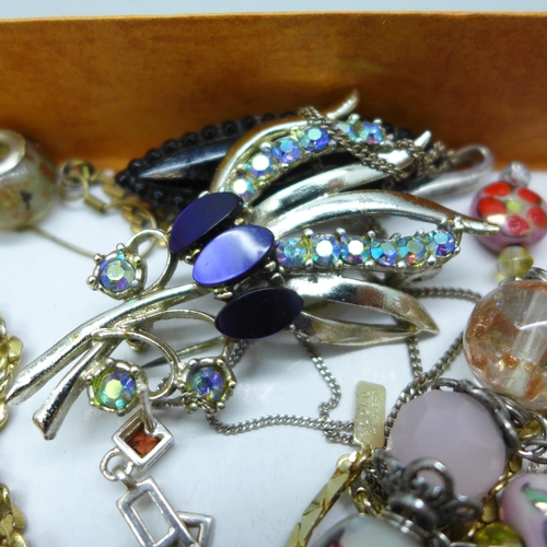 7274 - A collection of jewellery including two silver cross pendants, a pair of silver earrings, and other ... 