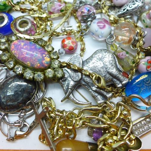 7274 - A collection of jewellery including two silver cross pendants, a pair of silver earrings, and other ... 