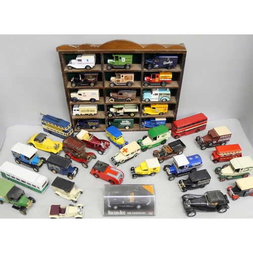 2108 - A collection of loose die-cast model vehicles to include Lledo, Matchbox, Welly, etc.