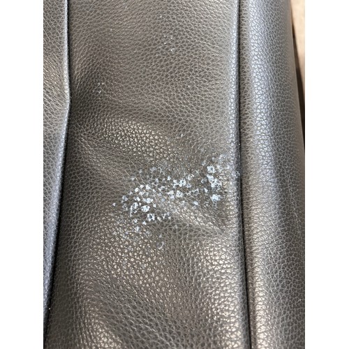 3175 - A Kuka Karma black chair with ottoman (damaged head rest) original RRP £583.33 + VAT (4239-17) *This... 