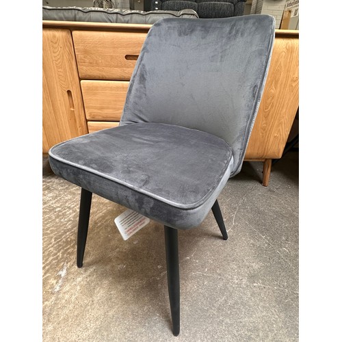 3160 - A light grey high gloss circular dining table and a set of four grey velvet dining chairs