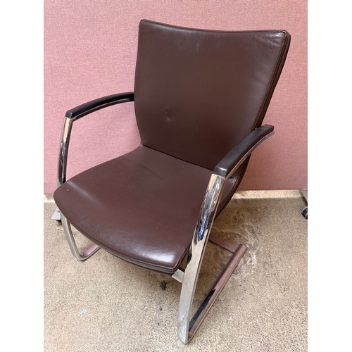 3239 - A set of four brown faux leather dining chairs with chrome legs