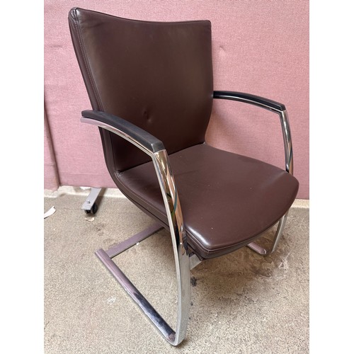 3239 - A set of four brown faux leather dining chairs with chrome legs