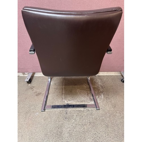 3239 - A set of four brown faux leather dining chairs with chrome legs