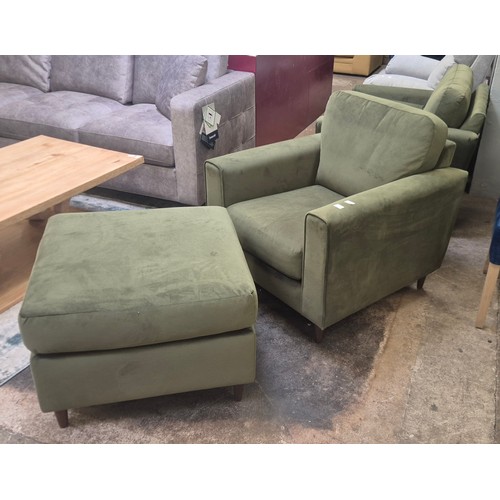 3117 - A moss green velvet upholstered armchair and matching pouffe