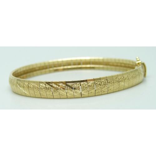 7003 - A 14ct gold bracelet with textured design, 14g, 18.5cm