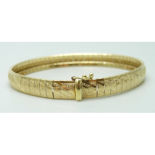 7003 - A 14ct gold bracelet with textured design, 14g, 18.5cm