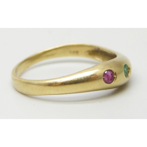 7008 - A 14ct gold three stone ring set with emerald, sapphire and ruby, 2.1g, O