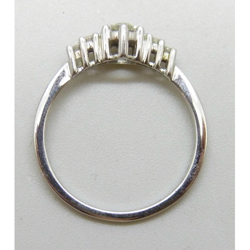 7018 - A 9ct white gold and diamond ring, 1.5g, L