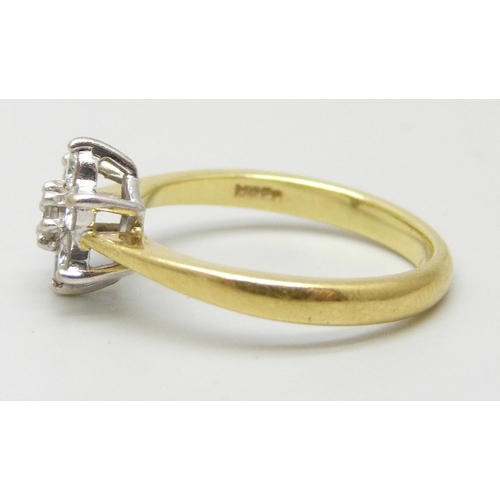 7022 - An 18ct gold and diamond cluster ring, 2.9g, J/K