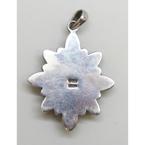 7024 - A Doug Paulus silver gemstone pendant set with amethyst and moonstone, 6.1cm including bail