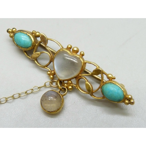 7025 - A Victorian yellow metal bar brooch set with cabochon moonstones and turquoise, the central stone in... 