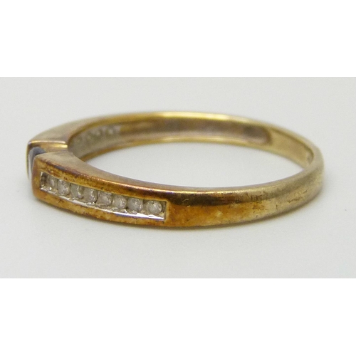 7030 - A 9ct gold, diamond and tanzanite ring, 1.3g, L
