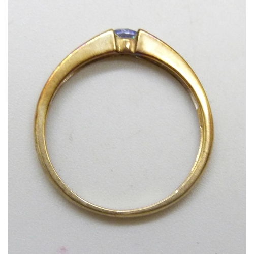 7030 - A 9ct gold, diamond and tanzanite ring, 1.3g, L