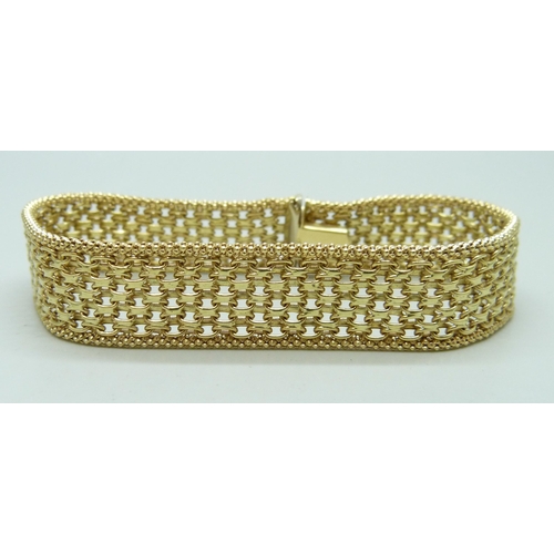 7036 - A 14ct gold woven link bracelet, marked 585, 18.7cm, 13.4g total weight, with receipt from Andros da... 