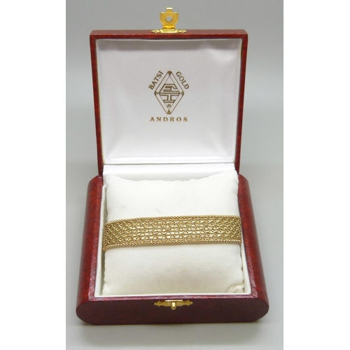 7036 - A 14ct gold woven link bracelet, marked 585, 18.7cm, 13.4g total weight, with receipt from Andros da... 