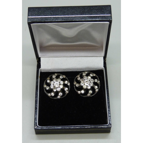 7037 - A pair of early 20th century paste set earrings, possibly converted from brooches or pins, 2.2cm