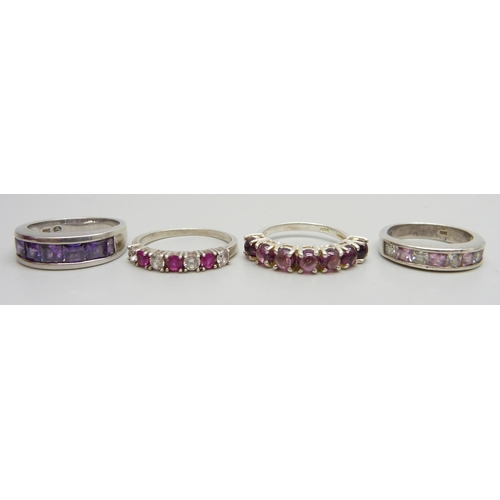 7040 - Four silver stone set rings, two silver pendants and chains, and a silver and 14ct applied gold deco... 