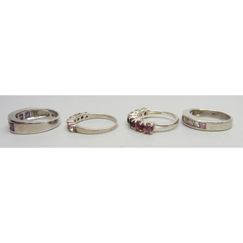 7040 - Four silver stone set rings, two silver pendants and chains, and a silver and 14ct applied gold deco... 