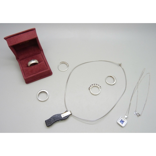 7040 - Four silver stone set rings, two silver pendants and chains, and a silver and 14ct applied gold deco... 
