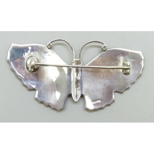 7041 - A large enamelled silver butterfly brooch, damage to enamel, one marcasite missing, 19g, 6.7cm