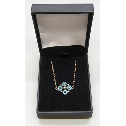 7053 - A yellow metal bracelet with a gilt metal cluster section (1.5cm) set with turquoise and old cut dia... 