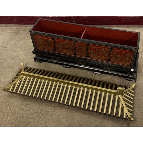 A Chinoiserie black lacquered temple shaped box