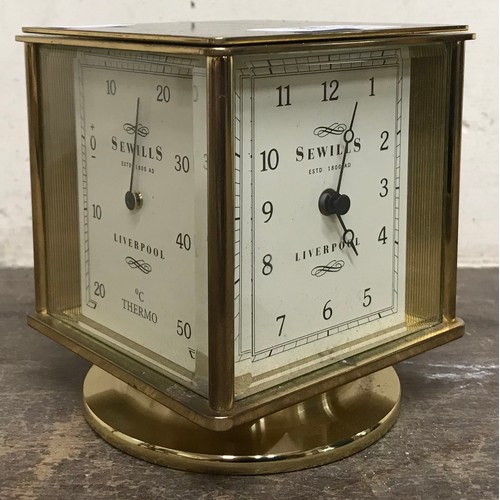 A Sewills of Liverpool brass revolving desk clock