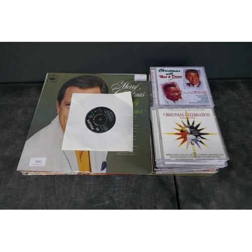 5001 - A quantity of assorted Christmas music including 8 records and 19 CDs. Records include Andy Williams... 