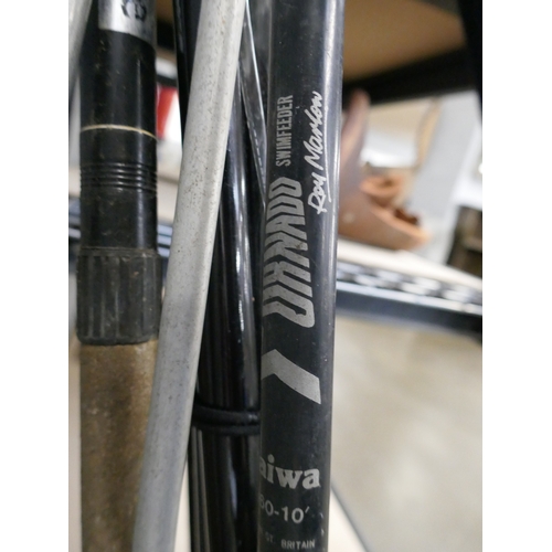 5067 - Three assorted fishing rods and a fishing bag with nets and quantity of assorted fishing reels