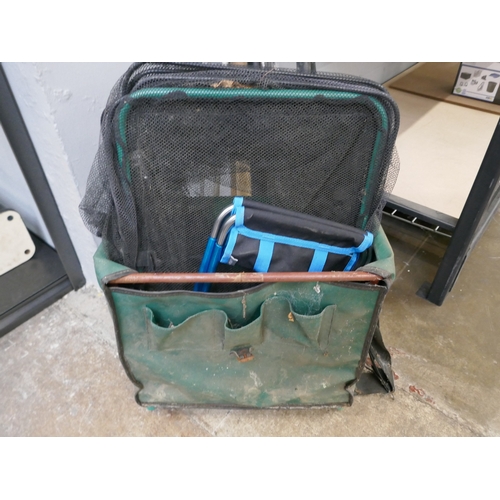 5067 - Three assorted fishing rods and a fishing bag with nets and quantity of assorted fishing reels