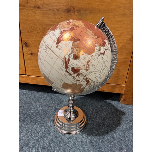 3081 - A world globe on chrome effect stand