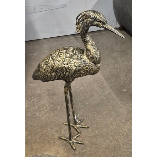 3202 - A black and gold effect heron decoration