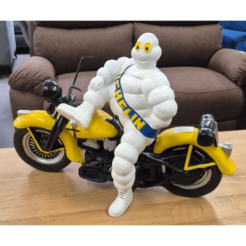 3207 - A resin figure depicting Michelin man on a motorcycle