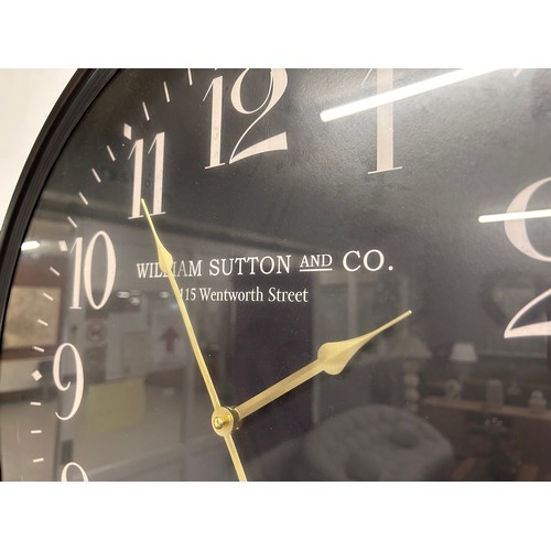 3208 - A ‘William Sutton and Co’ modern wall hanging clock