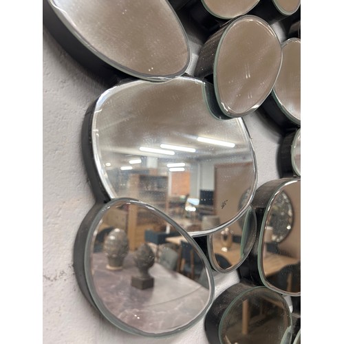 3220 - A pebble wall hanging mirror