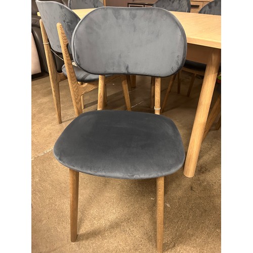 3233 - An Andersson Bianco oak extending dining table with a set of six Bari Opulence charcoal dining chair... 