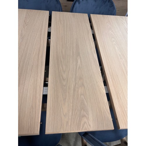 3234 - An Andersson Bianco oak extending dining table with a set of six Bari Opulence charcoal dining chair... 
